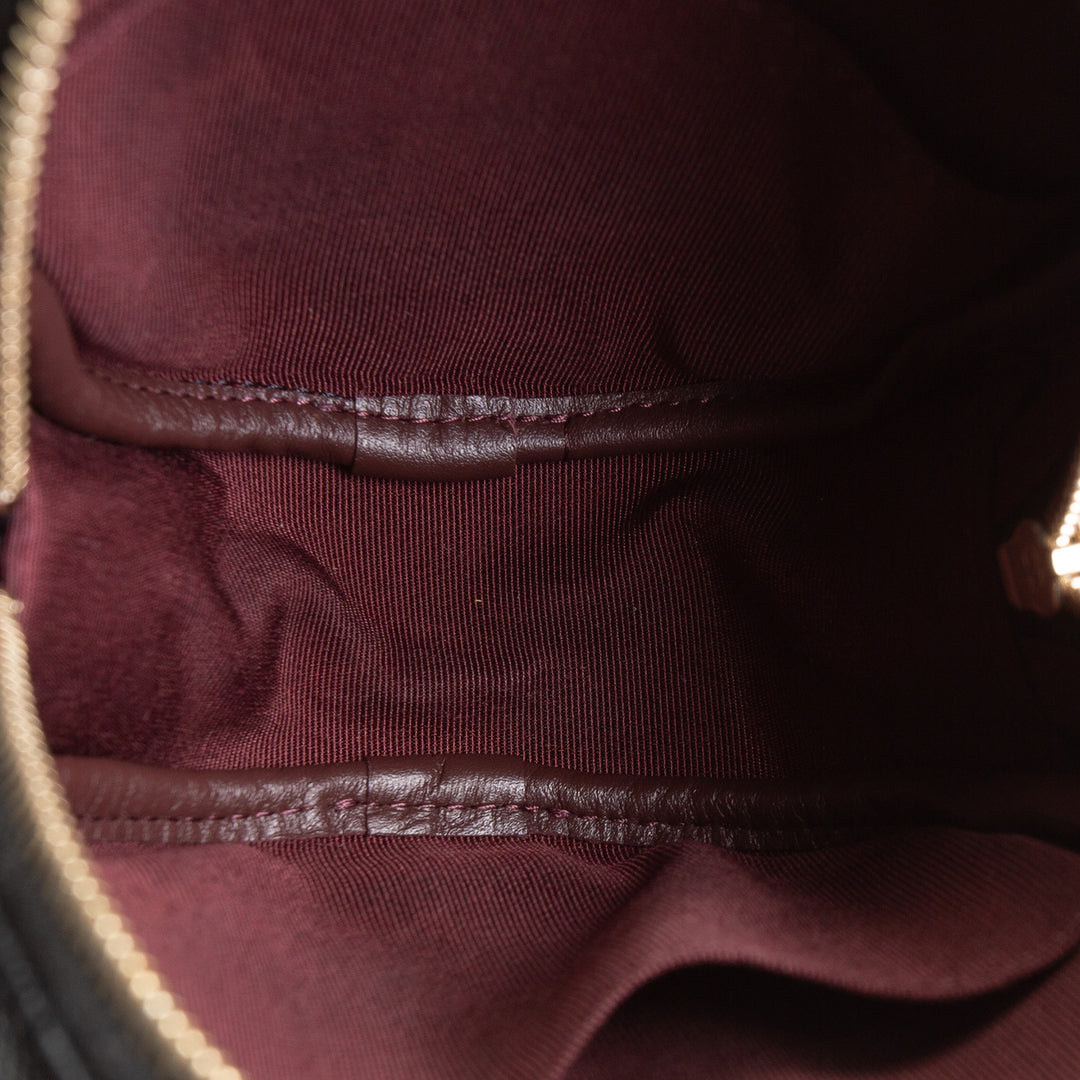 CHANEL Quilted Round Crossbody