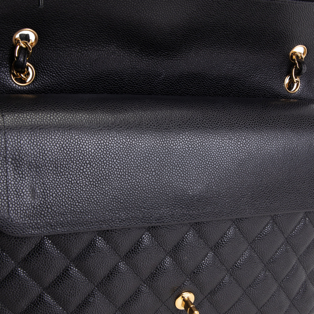 CHANEL Quilted Caviar Maxi Double Flap Bag - Black