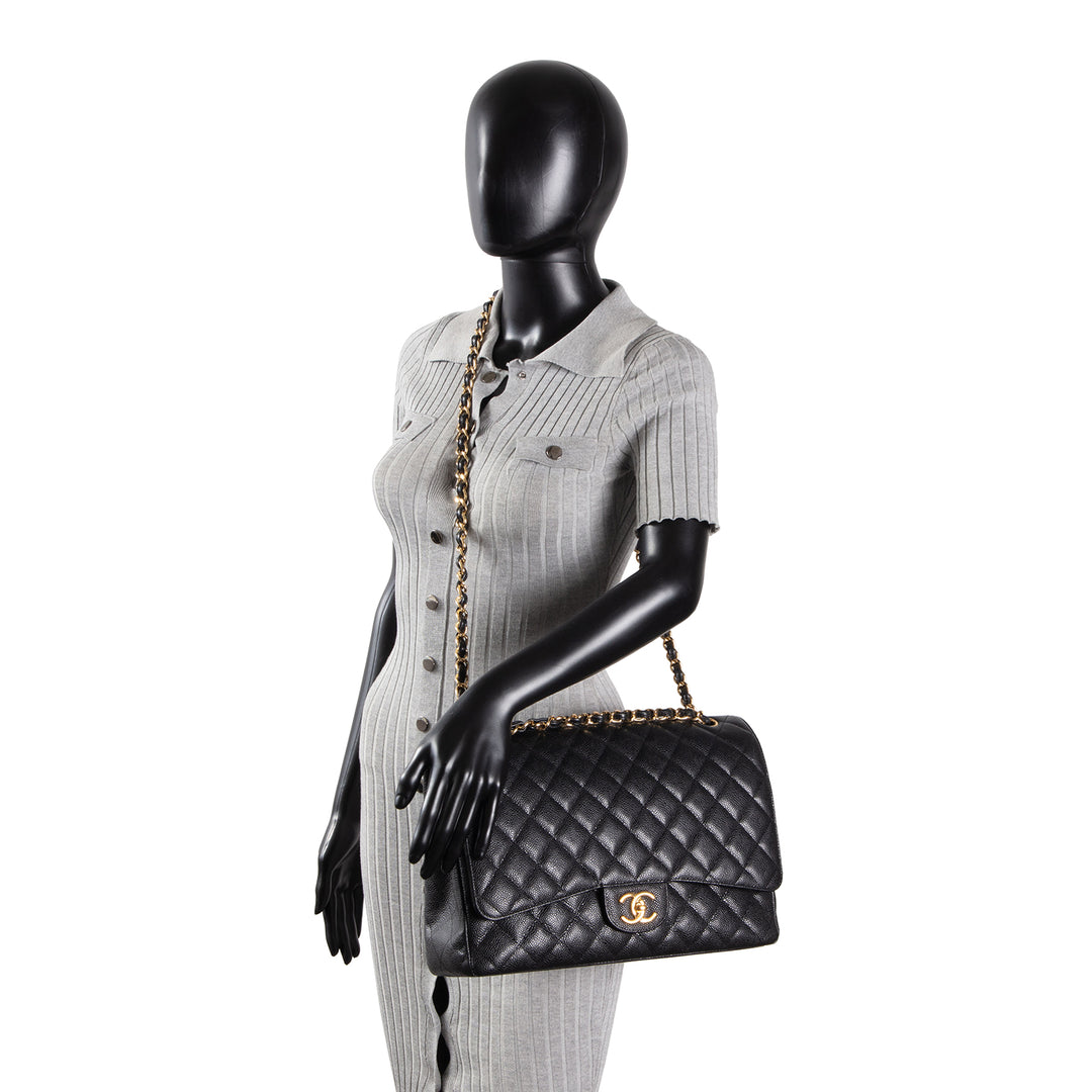 CHANEL Quilted Caviar Maxi Double Flap Bag - Black