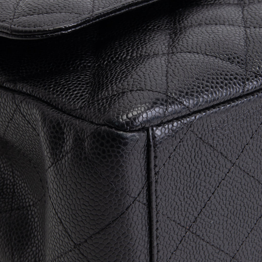 CHANEL Quilted Caviar Maxi Double Flap Bag - Black