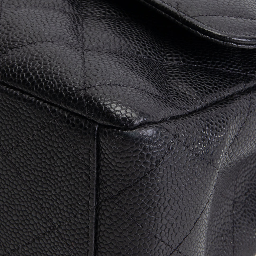 CHANEL Quilted Caviar Maxi Double Flap Bag - Black