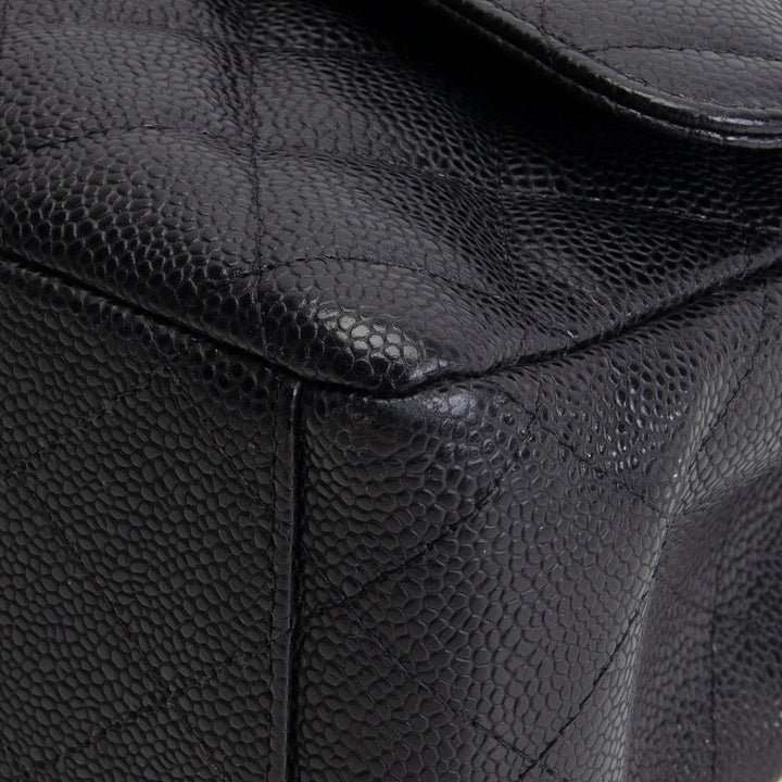 CHANEL Quilted Caviar Maxi Double Flap Bag - Black