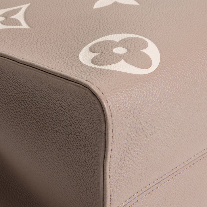 LOUIS VUITTON Bicolor Empreinte OntheGo MM - Dove/Cream