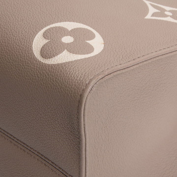 LOUIS VUITTON Bicolor Empreinte OntheGo MM - Dove/Cream