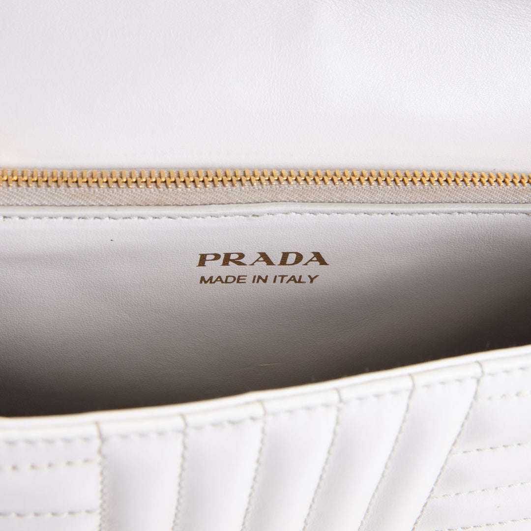 PRADA Curve Flap Diagramme Quilted Leather Bag - White