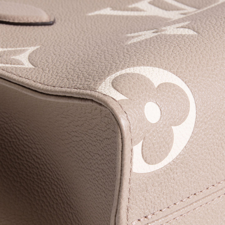 LOUIS VUITTON Monogram Empreinte Bicolor OnTheGo PM - Dove/Cream