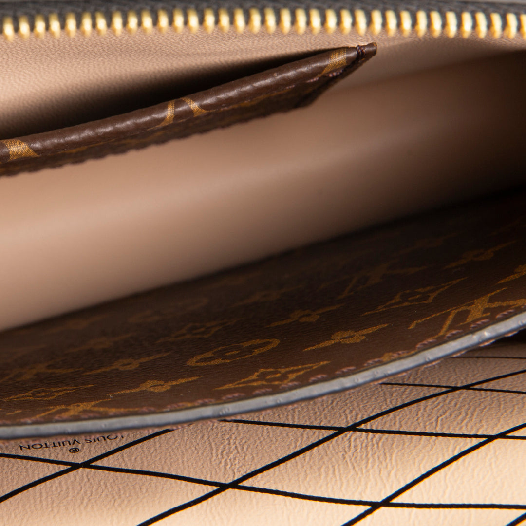 LOUIS VUITTON Reverse Monogram Trunk Clutch