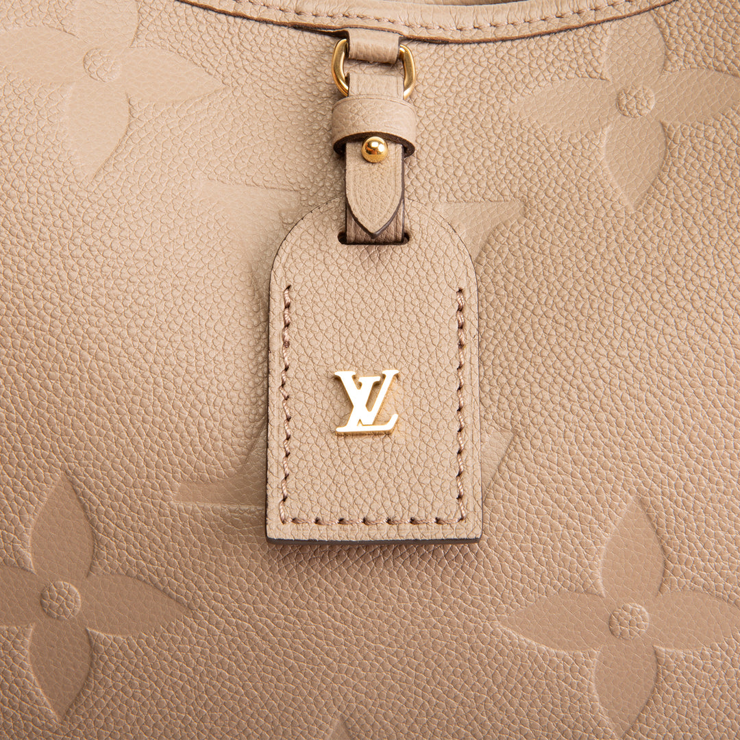 LOUIS VUITTON CarryAll MM Empreinte Giant Monogram - Turtledove